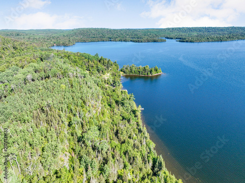 Foto Aerial view of a commercial waterfront land parcel surrounded by thick forest an