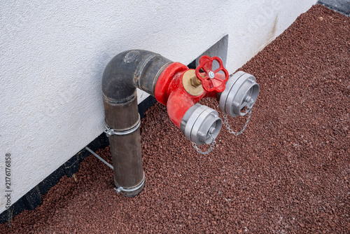 фотографія Red fire hydrant water pipe
