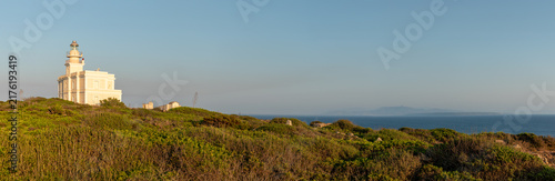 Картината върху платно Lighthouse, panorama of the San Giovanni in Sinis promontory, sea view at sunset, in the municipality of Cabras, Italy