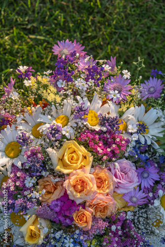 Vertical Close Up Of Colorful Wildflower Flowers Bouquet In Glass Vase