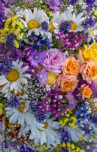 Vertical Close Up Of Colorful Bouquet With Daisies Roses And Lavender Flowers