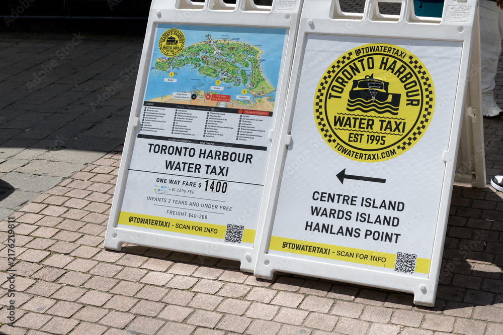 Obraz premium white plastic a-frame sidewalk signs near Toronto Harbour Water Taxi, York Quay Slip, 207 Queens Quay W