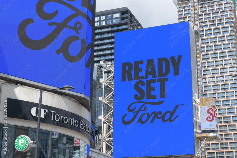 Obraz premium digital sign featuring ad for Ford Motor Company (Canada) at Sankofa Square, Toronto