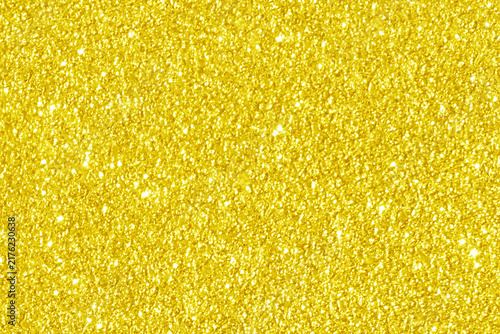 Golden yellow glitter light shiny texture background. New Year, Christmas, Wedding, Anniversary and Celebration background concept.