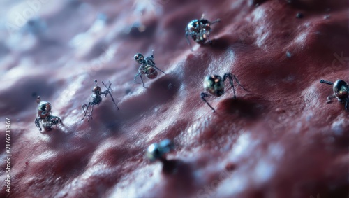 Microscopic view of tiny robotic ants exploring a textured surface.