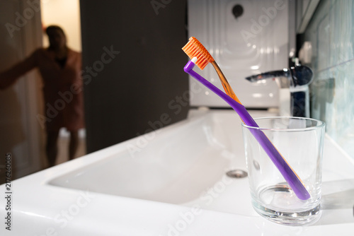 Photography Contemplative Woman by the Bathroom Sink, Choosing Between Habit and Evening Laz