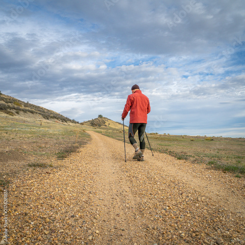 Tapety artystyczne senior man is Nordic walking in foothills of Rocky Mountains in Colorado - Prairie Ridge Natural Area