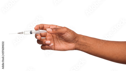 Pushing plastic syringe plunger in hand isolated on a transparent or black background. Pharmacist vaccination dosage preparation and clinical intravenous injection, medical therapy.