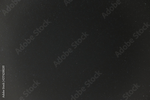 Starry Night Sky Background with Faint Meteor Trails and Deep Space Stars
