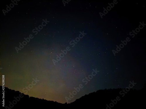 Starry Night Sky Background with Faint Meteor Trails and Deep Space Stars