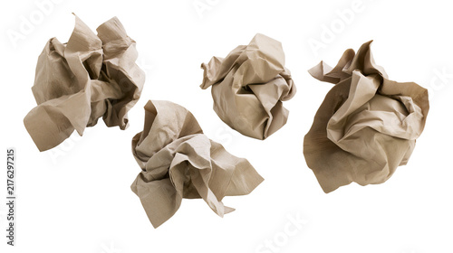 фотографія Three crumpled brown paper napkins with rough texture and folded creases