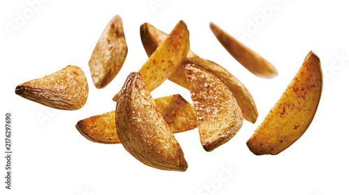 Golden crispy seasoned potato wedges with salt and paprika