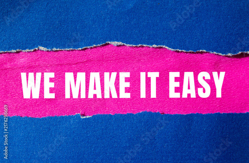 We make it easy message written on ripped torn paper background. Conceptual We make it easy symbol. Copy space.