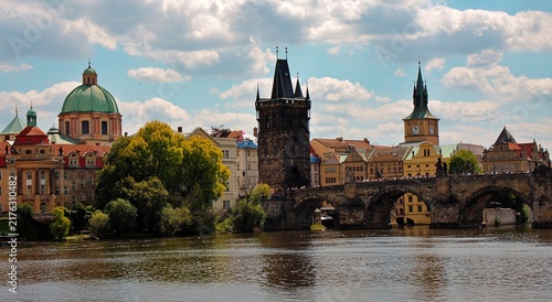 Принти на полотні Prague, Czech Republic: Charles Bridge over Vltava River with Old Town Bridge Tower and historic Prague skyline under cloudy summer sky