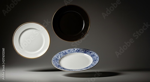 Three plates with different designs floating.