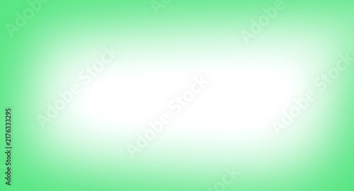 Abstract soft green gradient background with a bright white center glow
