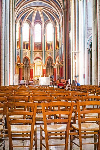 Obraz na plátně Historical Gothic church interior with an altar and parishioners