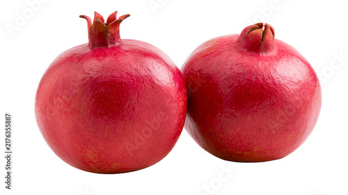Obraz na plátne Two ripe whole red pomegranates with smooth skin and green crowns