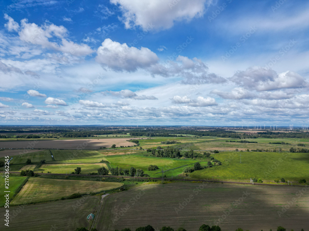 Fototapeta premium Aerial drone view of agricultural fields and railway line near Wustermark Brandenburg Germany