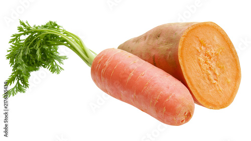 Fresh orange carrot with green leaves and a halved sweet potato