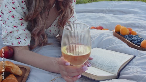 Peaceful afternoon outdoors with a book, wine, and fresh fruits