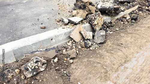 Broken asphalt and pavement debris removed during road reconstruction, showing demolition of old infrastructure before installation of a renewed urban surface