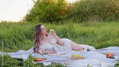 Enjoying a serene outdoor picnic filled with fresh fruits and a good book