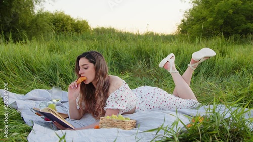 Enjoying a Relaxing Picnic in Nature Savoring a Good Book and Tasty Snacks