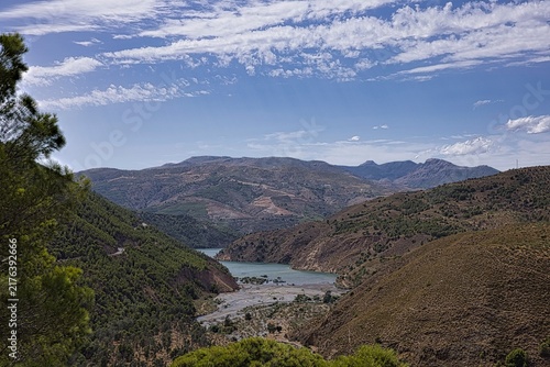 Sierra nevada mountain valley with reservoir and pine trees