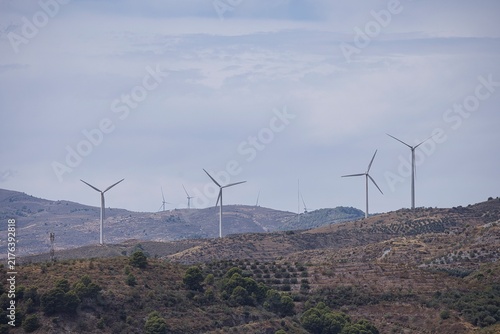 Wind turbines generating clean energy on a mountain landscape