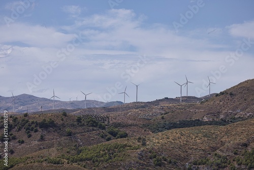 Wind turbines generating clean energy on a mountain landscape