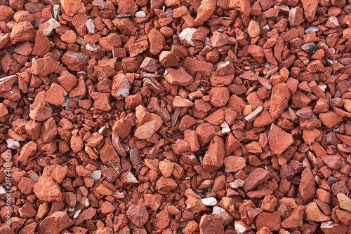 Crushed red clay brick chips texture background