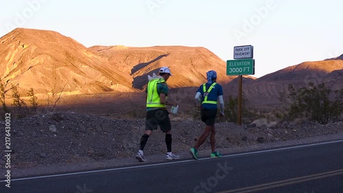 Athlete getting water spray down as they cross the 3000 feet mark in death valley