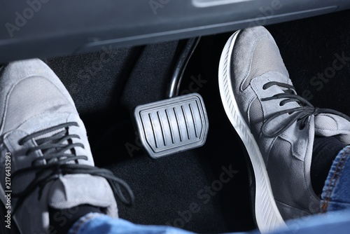 Konstfotografi Man pushing accelerator pedal in car, closeup on foot