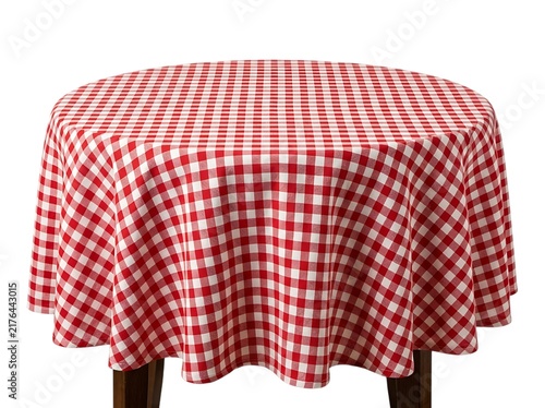 A round wooden table covered with a classic red and white checkered tablecloth, viewed from a slightly elevated angle, isolated on a clean white background
