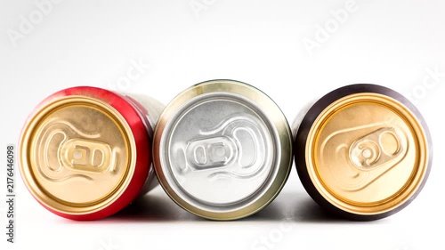 three metal cold cans with beer