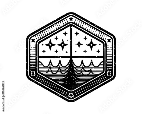 Grunge style hexagonal emblem depicting a starry night sky over ocean waves in black and white