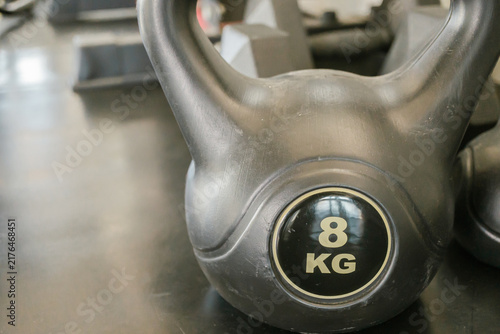 Cuadro en lienzo Focused asian man exercising in gym with intense fitness wellness health effort