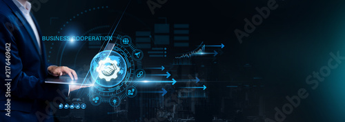 Cuadro en lienzo Businessman using laptop for analyzing Business Cooperation and global partnership data, collaboration, strategic alliances, corporate networking, business growth