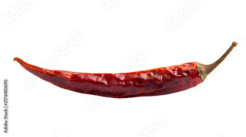 Whole dried red chili pepper spice with wrinkled skin and curved stem isolated on transparent background, food ingredient in Prague, Czechia