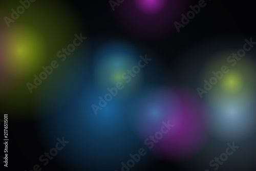 Abstract background with colorful glowing light circles and soft blurred spots for digital design projects