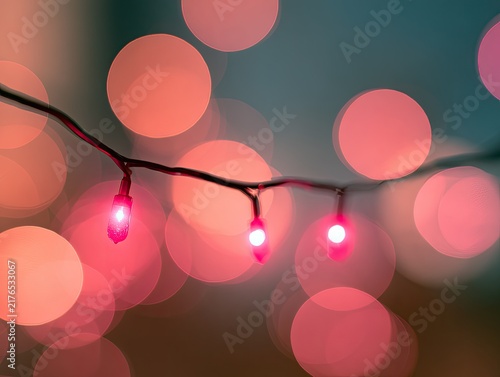 Strand of pink lights with soft, blurred bokeh circles in background