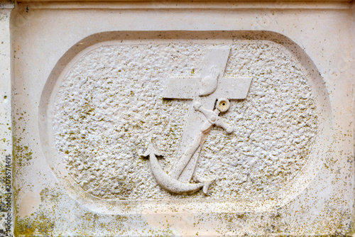 Carved Stone Cross and Anchor Symbol of Hope on Historical Gravestone