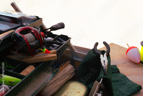 Canvastavla Fishing equipment and accessories are packed into a tackle box, showcasing a col