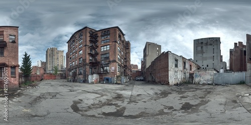 Urban decay panorama - Crumbling buildings under a stormy sky.