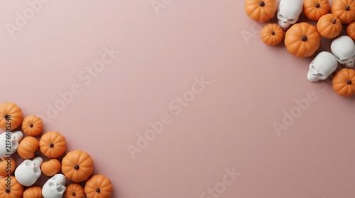 Festive halloween background with decorative orange pumpkins and white skulls arranged on a soft pink surface