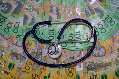 Stethoscope on Australian banknote in concept of Australia economy care, Health insurance and medical cost.