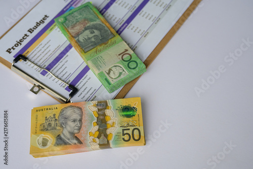 Budgeting and projects planning concept, Australian dollars note and clipboard showing budget management and business planning.