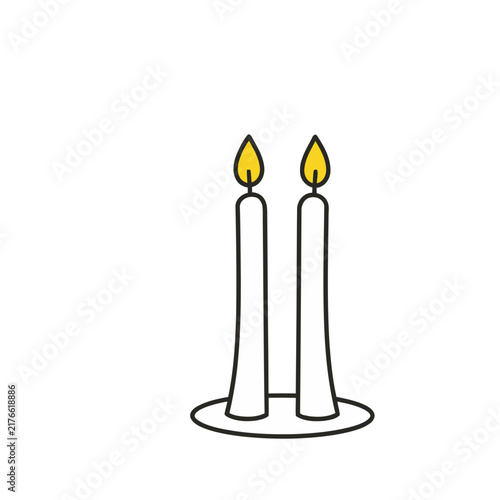 Two lit candles on a white background