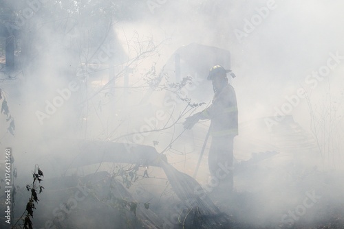 Firefighter in heavy smoke